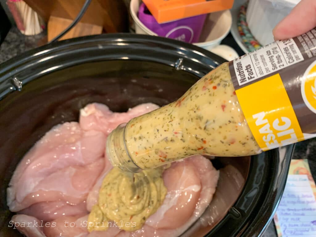 pour dressing over the chicken