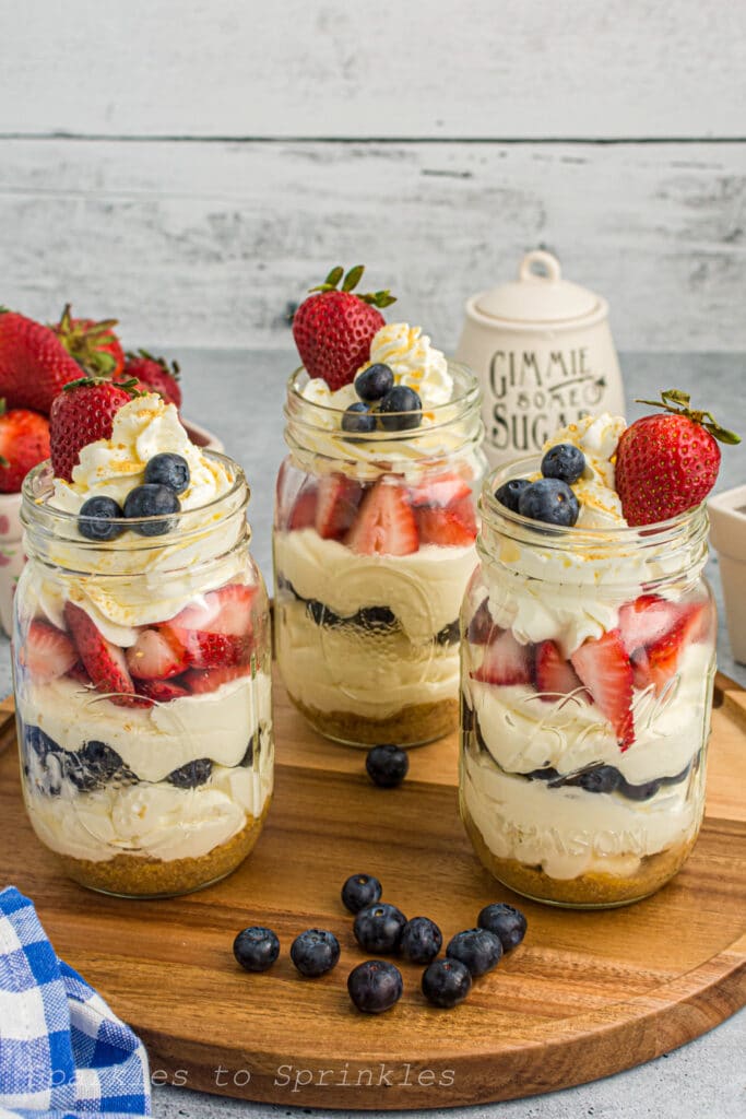 red white and blue no bake cheesecake in a jar